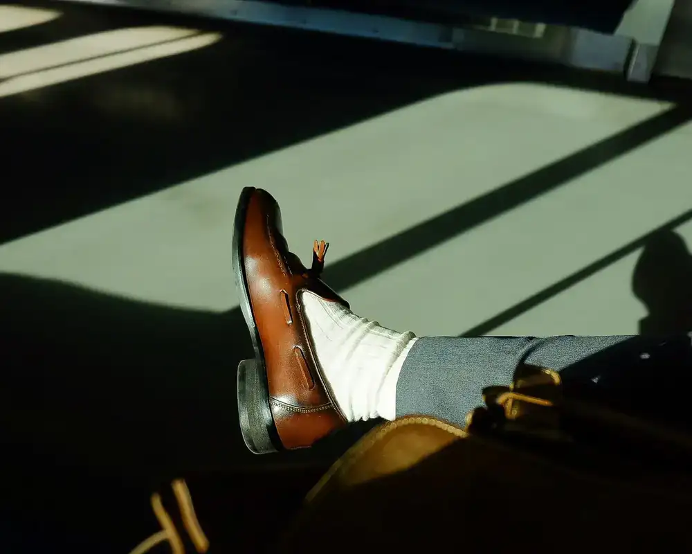 Close view of polished dress shoes after complete sole restoration